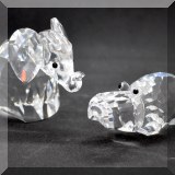 C38. Swarovski Crystal elephant and hippo. 